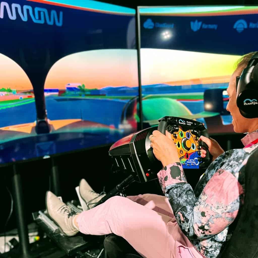 Branded racing simulator hire attracting attendees at a product launch event in London UK.