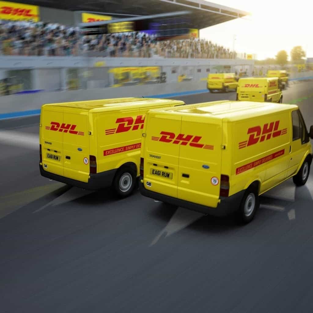 Two DHL vans in head to head race in a virtual racing experience hired for event in London, UK.