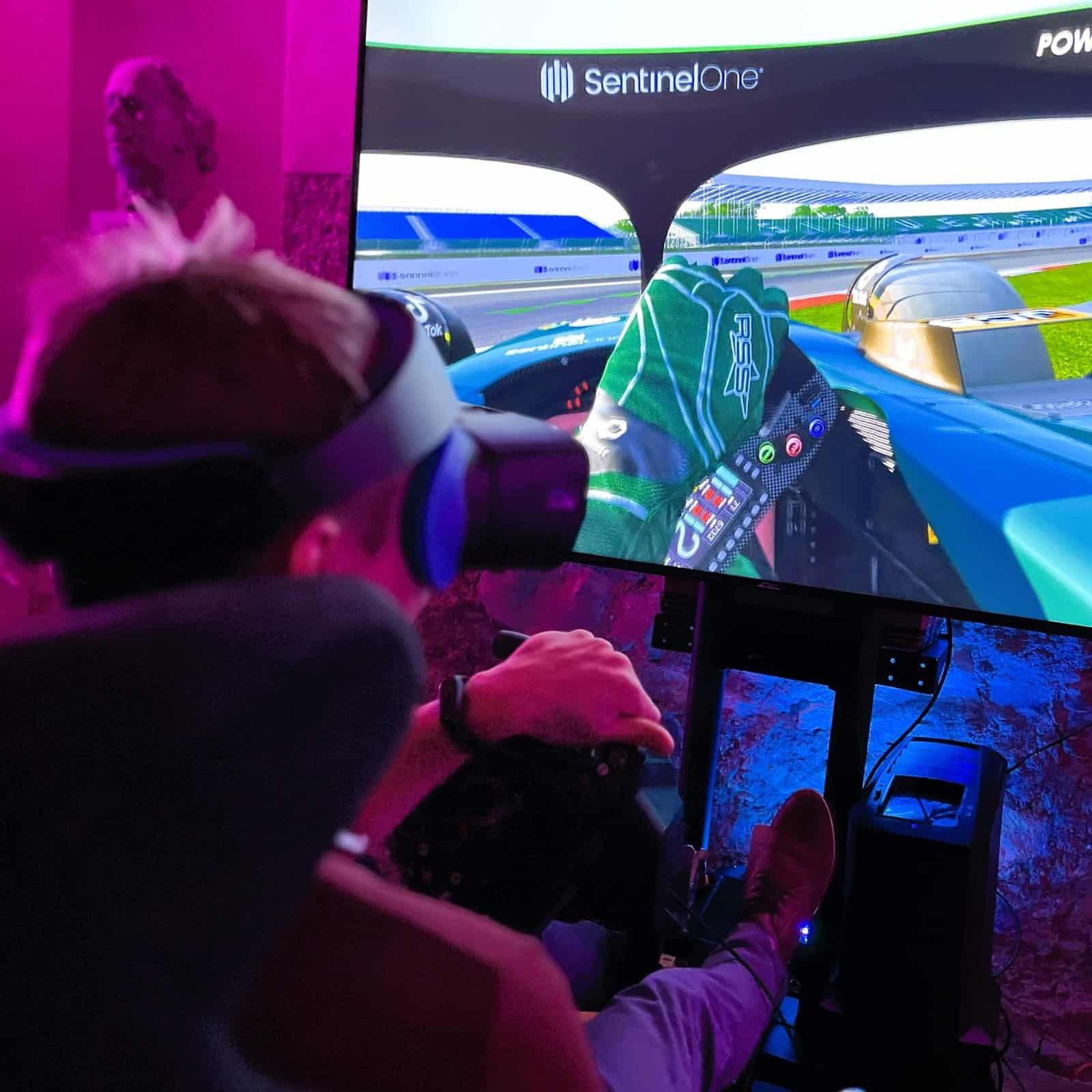 RoarFun Clients SentinelOne Aston Martin F1 team sponsor - Formula 1 immersive motion VR simulator at Christmas Party.