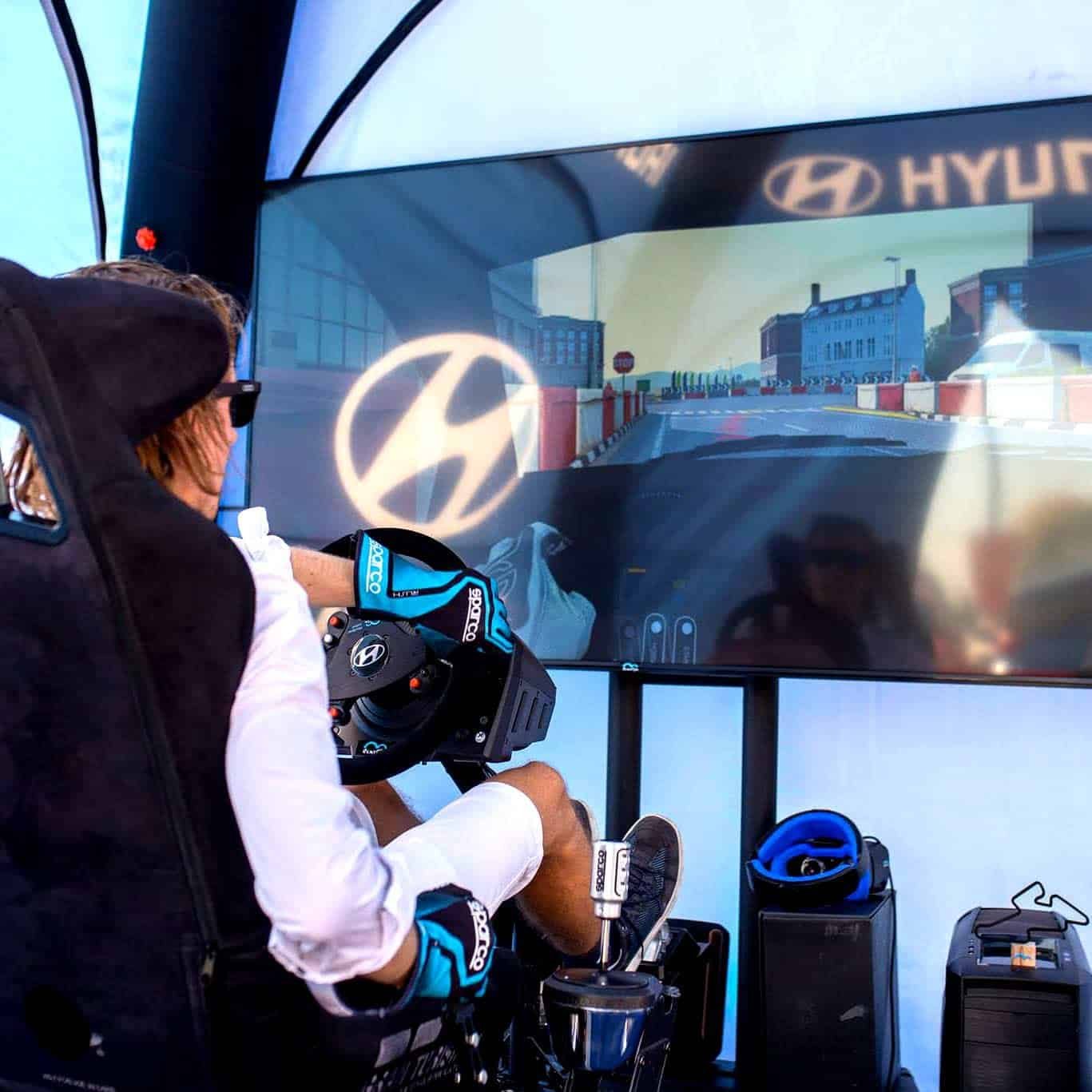RoarFun Clients Hyundai real motion rally simulator entertainment on Hyundai Road Show customer presentation