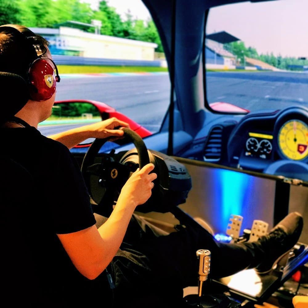 Ferrari licensed headphones and ferrari steering wheel for the Semrush SEO RoarFun Clients racing simulator at IT conference