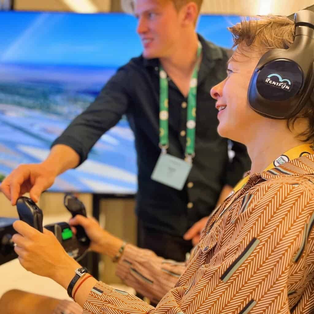 Happy person on a motion flight simulator with support.