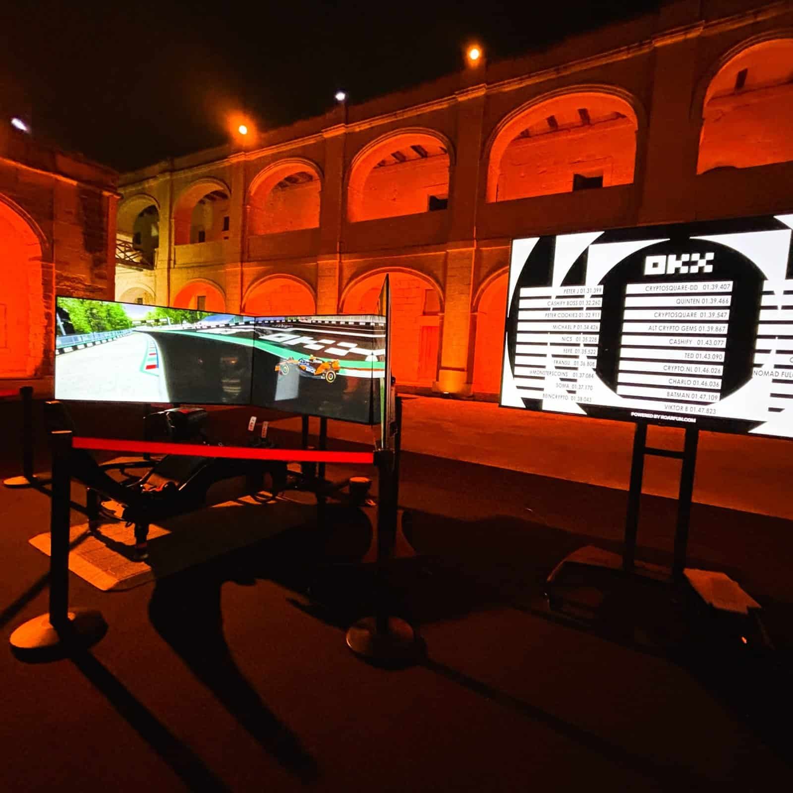 Motion Formula simulator at night on a the square on open sky in Malta for event of OKX F1 Sponsor.