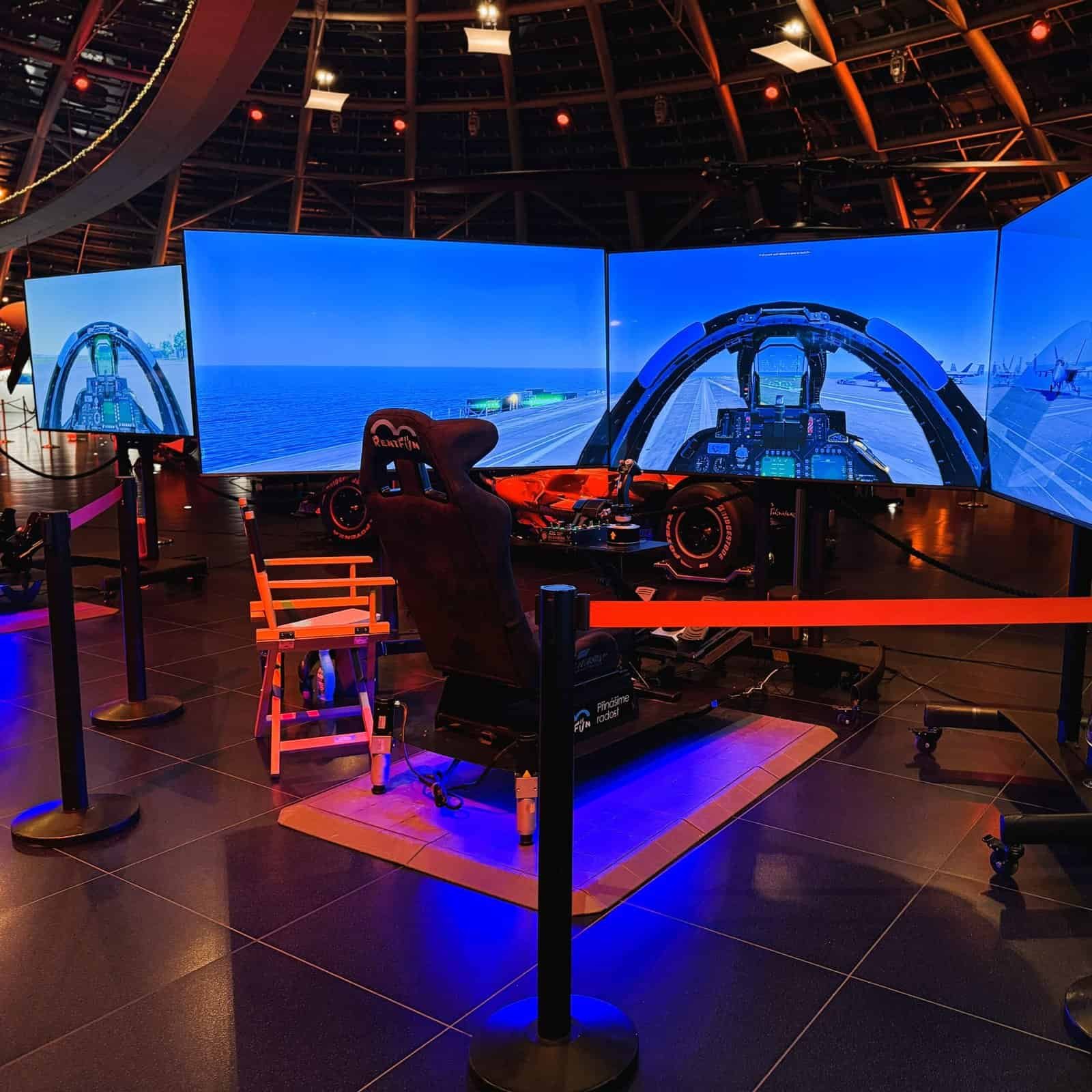 A fighter jet simulator with the jet departing from an aircraft carrier in a warm ambience at Salzburg, Austria.